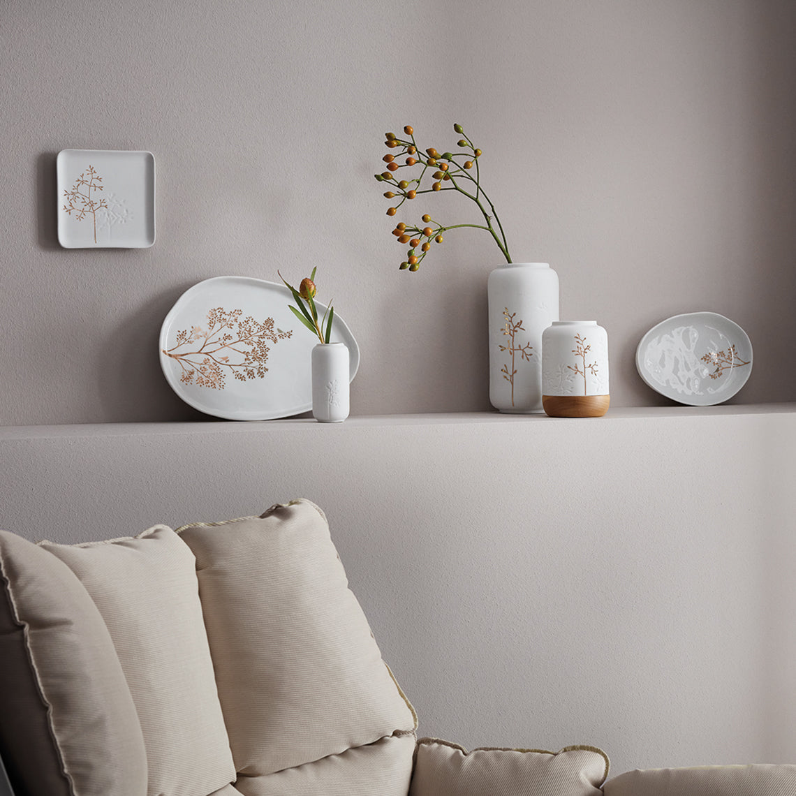 Porcelain plate with a golden branch