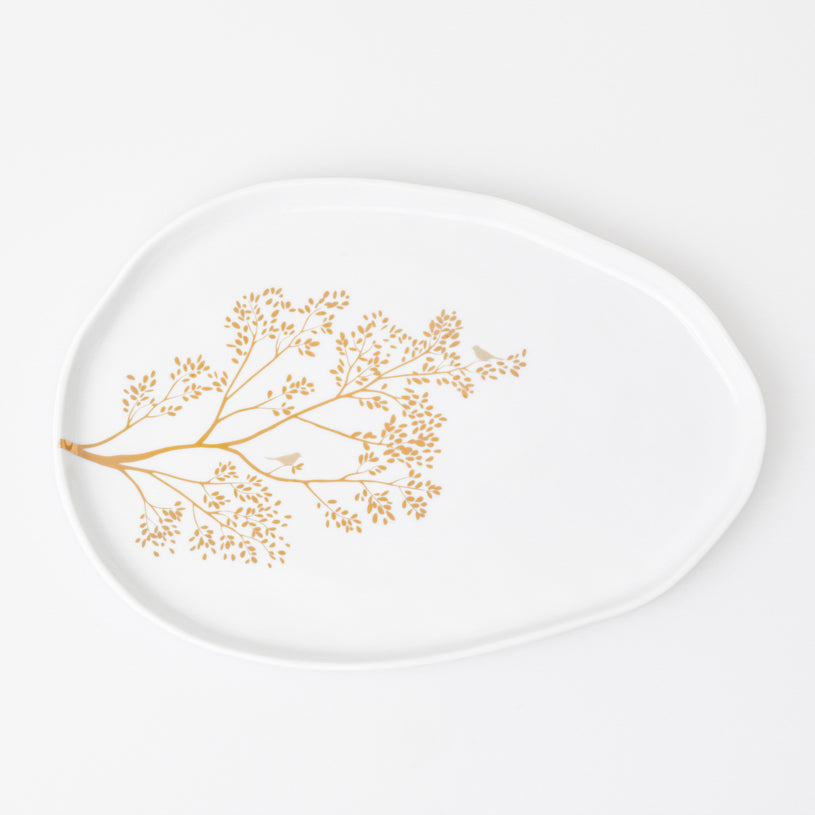 Porcelain plate with a golden branch