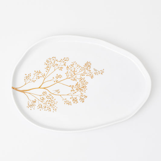 Porcelain plate with a golden branch