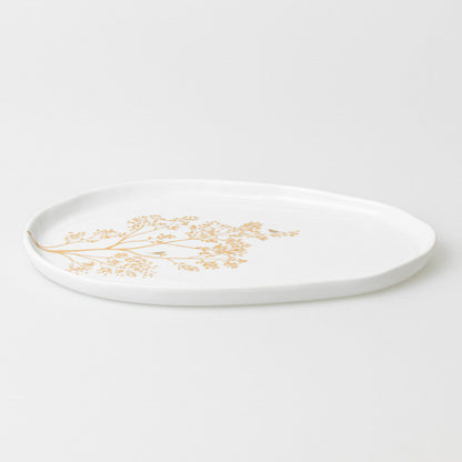 Porcelain plate with a golden branch
